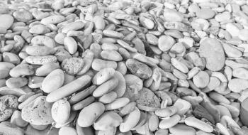 White pebble on a sea coast, natural background photo