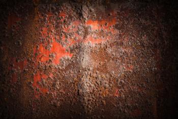 Old dark red rusted iron wall, industrial background photo texture with vignette effect