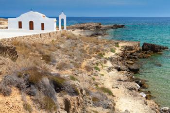 Agios Nikolaos. White Orthodox church on the Sea. Rocky coast of island Zakynthos, Greece