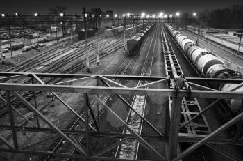 Sorting railway station with illumination at night, black and white photo