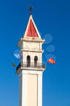 Bell tower with flags. Agios Dionysios church of Zakynthos, Greek island in the Ionian Sea