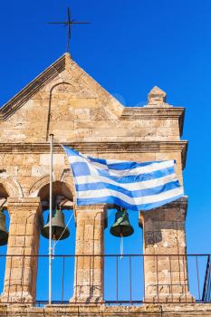 Greek flag on Church of Saint Nicholas of Mole on Solomos Square. Zakynthos, Greek island in Ionian Sea