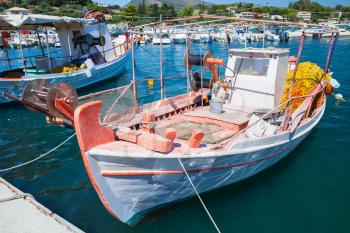 Vintage wooden fishing boat moored in port of Agios Sostis village. Zakynthos, Greek island in the Ionian Sea