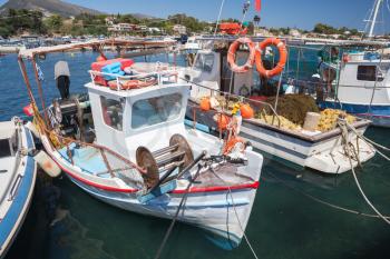 Vintage wooden fishing boats moored in port of Agios Sostis village. Zakynthos, Greek island in the Ionian Sea