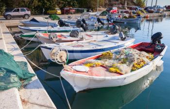 White wooden fishing boats with nets moored in bay of Tsilivi. Zakynthos, Greek island in the Ionian Sea
