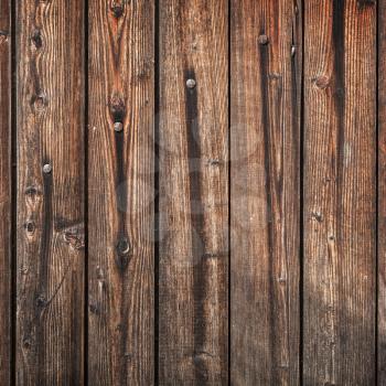 Old dark brown wooden wall background photo texture
