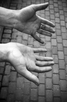 Male working hands. Closeup monochrome photo
