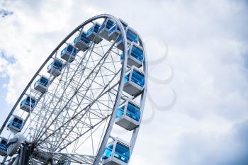 Ferris wheel on cloudy sky background. Helsinki, Finland