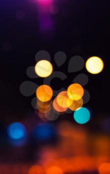 Colorful blurred lights, bokeh optical effect. Vertical abstract photo background