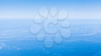 Empty seascape with clear blue sky and still water. Natural background photo, bird eye view