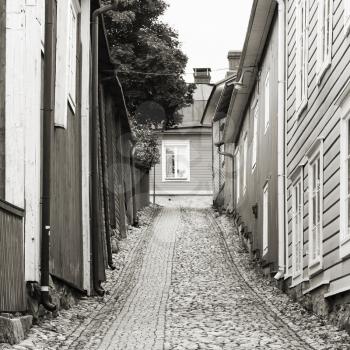 Monochrome square street view with wooden houses in old town of Porvoo, Finland