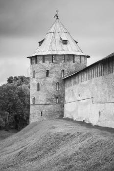 Vertical photo of Novgorod Kremlin, also known as Detinets. Bank of the Volkhov River in old russian town Veliky Novgorod. Black and white photo