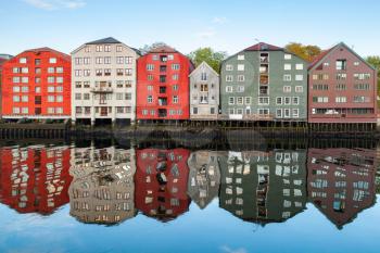 Coast of Nidelva river. Colorful wooden houses in old town of Trondheim, Norway