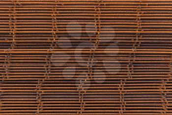 Abstract industrial background, stack of rusted reinforcing mesh elements
