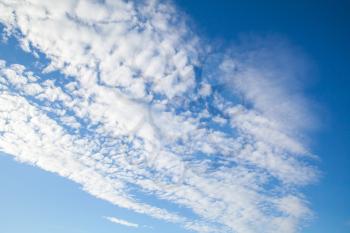 Natural blue sky with white altocumulus clouds at daytime, background photo texture
