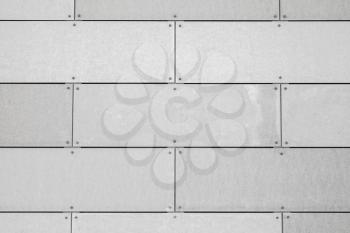 Industrial wall background texture. Decorative gray tiling pattern