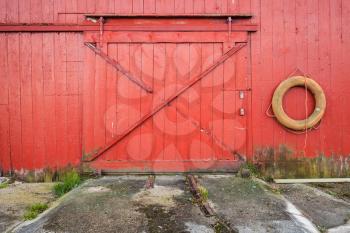 Closed gate of Norwegian fishing barn, background texture