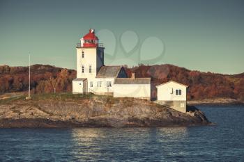 Tyrhaug Lighthouse. Coastal tower located in Smola Municipality, More og Romsdal county, Norway. The lighthouse was established in 1833. Vintage tonal correction filter, old instagram style efect