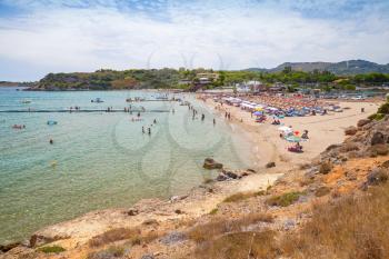 Tourists relax on Agios Nikolaos beach, Greek island of zante. It is a popular beach in Vassilikos, Zakynthos, Greece