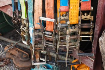Group of colorful slings with steel buckles