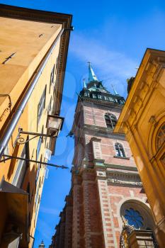 Street view of old Stockholm town with The German Church, also called called St. Gertrudes Church in Gamla stan, Sweden
