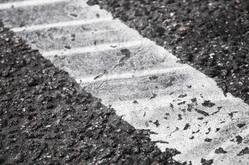 White dividing line fragment with tire tracks, highway road marking. Abstract transportation background