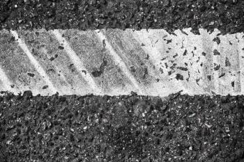 White line with tire tracks, highway road marking fragment. Abstract transportation background