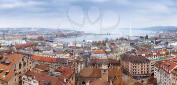 Geneva city, Switzerland. Panoramic cityscape of old central area and Geneva Lake, photo taken from St. Pierre Cathedral viewpoint