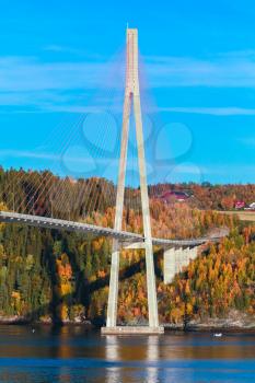 Modern cable-stayed bridge in Norway, vertical photo of Skarnsund Bridge