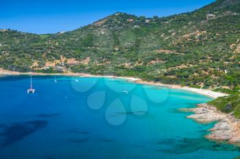 Summer coastal landscape of South Corsica. Small azure bay with yachts, Piana region, France
