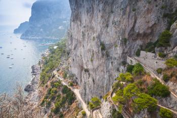 Coastal mountain road on rocks of Capri island, Italy