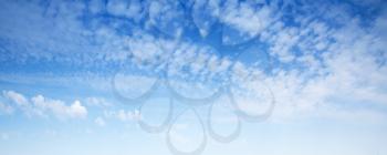 Natural blue sky with white altocumulus clouds, panoramic background photo texture