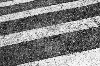 Zebra. Pedestrian crossing road marking, white stripes over dark asphalt pavement, background photo