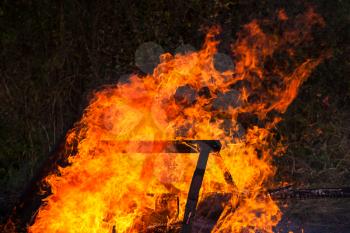 Close up photo of burning furniture in big bonfire