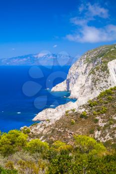 Navagio bay, Greece, coastal summer landscape. White rocks under blue sky, vertical photo