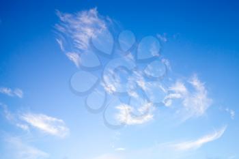 White clouds in deep blue sky, natural photo background 