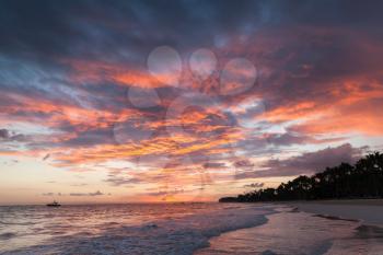 Colorful cloudscape in sunrise over Atlantic Ocean coast, Bavaro beach, Hispaniola Island. Dominican Republic, coastal landscape