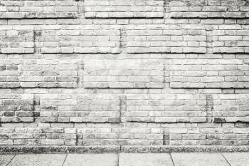Abstract empty urban interior background with gray decorative brick wall and concrete floor tiling