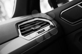 Air ventilation grille with wheelstick regulator, modern car interior details