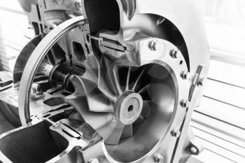 Turbocharger structure scheme with cross section, black and white photo with selective focus