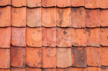 Vintage red roof tiling, close up frontal background photo texture