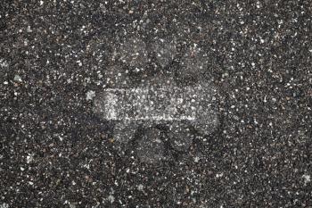 White grungy stripe on dark gray tarmac, highway road marking. Abstract transportation background texture