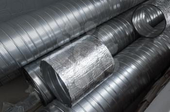 Group of shiny metallic tubes for air ventilation systems
