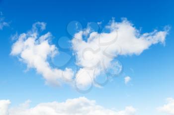 White cumulus clouds in blue sky, natural photo background texture