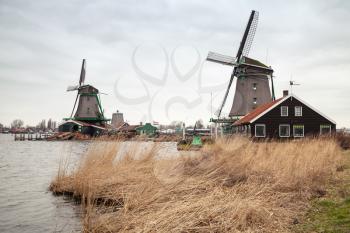 Windmills on the Zaan river coast, Zaanse Schans town is one of the popular tourist attractions of the Netherlands