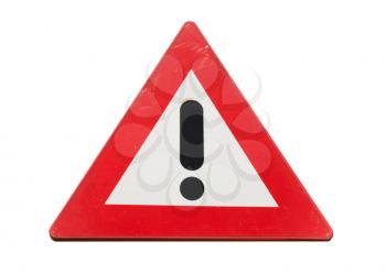 Warning road sign with black exclamation mark in red triangle isolated on white background, close up photo