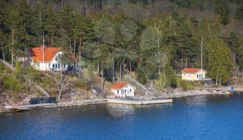 Swedish rural landscape, coastal view with white wooden houses