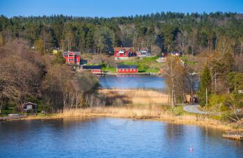 Swedish rural landscape, coastal village with red wooden houses