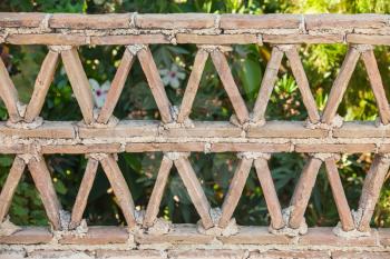 Old balcony railings made of clay blocks, Greek style architecture details, front view