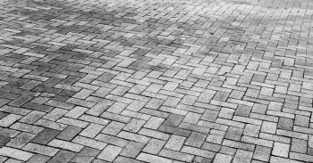 Gray cobblestone road pavement, wide background photo texture